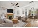 Bright living room features a cozy fireplace, ceiling fan, and comfortable seating area at 2534 N 10Th St, Phoenix, AZ 85006