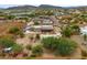 An aerial view shows mature landscaping, a playset, a pool, and a covered porch in the backyard at 3019 W Trail Dr, Phoenix, AZ 85086