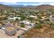 An aerial view shows this desert property's ample parking, desert landscaping, and proximity to nearby mountains at 3019 W Trail Dr, Phoenix, AZ 85086