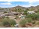 An aerial shot of this home showcases the pool, yard, and proximity to desert scenery at 3019 W Trail Dr, Phoenix, AZ 85086