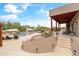 Inviting backyard with covered patio, a refreshing pool with a waterfall, desert landscaping and ample seating areas at 3019 W Trail Dr, Phoenix, AZ 85086