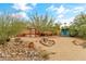 Home backyard featuring a shed, garden, and landscaping at 3019 W Trail Dr, Phoenix, AZ 85086