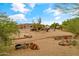 Wide view of desert home backyard with play area, spa, and landscaping at 3019 W Trail Dr, Phoenix, AZ 85086