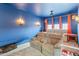 Basement home theater room with comfortable seating, soft carpet, and sconce lighting at 3019 W Trail Dr, Phoenix, AZ 85086