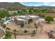 Modern desert home with a flat roof, sprawling landscape, private pool, and mountain views at 3019 W Trail Dr, Phoenix, AZ 85086