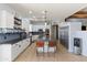 Spacious kitchen features white cabinetry, stainless steel appliances, and a large center island with seating at 3019 W Trail Dr, Phoenix, AZ 85086