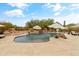 Backyard pool featuring a stone waterfall feature, desert landscaping and multiple seating areas with shade at 3019 W Trail Dr, Phoenix, AZ 85086