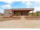 Expansive home exterior with covered patio, desert landscaping, and paver driveway at 3019 W Trail Dr, Phoenix, AZ 85086