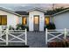 Charming home entrance with a white picket fence, tiled courtyard, and neatly manicured landscaping at 3101 E Sells Dr, Phoenix, AZ 85016