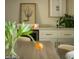 Stylish living room with built in cabinetry, a beverage center, and tasteful decor with pops of greenery at 3101 E Sells Dr, Phoenix, AZ 85016