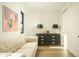 Cozy living room featuring a plush sofa, stylish dresser, and ample natural light at 3101 E Sells Dr, Phoenix, AZ 85016