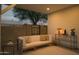 Cozy patio area with comfortable seating, a stylish table, and view of the backyard's lush greenery at 3101 E Sells Dr, Phoenix, AZ 85016