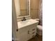 Updated bathroom features a stylish vanity with quartz countertop, modern hardware, and a coordinated mirror and lighting at 3131 W Cochise Dr # 218, Phoenix, AZ 85051