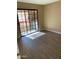 Bedroom featuring sliding glass door to the balcony, neutral color scheme, and modern flooring, creating a serene space at 3131 W Cochise Dr # 218, Phoenix, AZ 85051