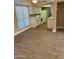 Bright kitchen features white appliances and cabinets with a modern countertop, complementing the light wood-look flooring at 3131 W Cochise Dr # 218, Phoenix, AZ 85051