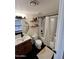 Charming bathroom with dark fixtures, a shower-tub combo, stylish vanity, and modern décor at 3314 N 68Th St # 107, Scottsdale, AZ 85251