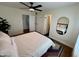 Bright bedroom with a ceiling fan and multiple doorways including one to the bathroom at 3314 N 68Th St # 107, Scottsdale, AZ 85251