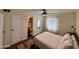 Bright bedroom featuring a queen bed, white walls, and a view into the connected bathroom at 3314 N 68Th St # 107, Scottsdale, AZ 85251