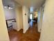 Inviting hallway view showcasing modern lighting and an open layout leading to a comfortably furnished living space at 3314 N 68Th St # 107, Scottsdale, AZ 85251