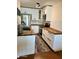 Bright kitchen features white cabinetry, wood countertops, stainless steel appliances, and modern fixtures at 3314 N 68Th St # 107, Scottsdale, AZ 85251