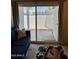 Cozy living area with a sliding glass door leading to an outdoor patio for relaxed indoor-outdoor living at 3314 N 68Th St # 107, Scottsdale, AZ 85251