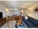 Living room showcasing an open floor plan, with a dining area, comfortable seating, and modern decor at 3314 N 68Th St # 107, Scottsdale, AZ 85251