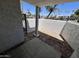 Enclosed patio area features privacy walls and gated entrance, offering a private outdoor space at 3314 N 68Th St # 107, Scottsdale, AZ 85251