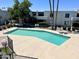 Community pool surrounded by apartment complex at 3314 N 68Th St # 107, Scottsdale, AZ 85251