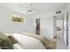 Bright bedroom featuring closet, adjacent bathroom, neutral walls, ceiling fan, carpet flooring and decor at 3616 E Fairmount Ave, Phoenix, AZ 85018