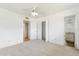 Spacious bedroom with a closet, ceiling fan, and view to bathroom at 3616 E Fairmount Ave, Phoenix, AZ 85018