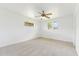 Bright bedroom featuring neutral walls, ceiling fan, carpet flooring and two windows allowing natural light at 3616 E Fairmount Ave, Phoenix, AZ 85018