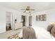 Bright bedroom featuring closet, adjacent bathroom, neutral walls, ceiling fan, carpet flooring and decor at 3616 E Fairmount Ave, Phoenix, AZ 85018