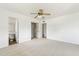 Bright bedroom featuring closet, adjacent bathroom, neutral walls, ceiling fan and carpet flooring at 3616 E Fairmount Ave, Phoenix, AZ 85018