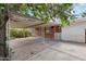 Large carport next to the house, offering covered parking and brick accents at 3616 E Fairmount Ave, Phoenix, AZ 85018