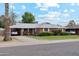 Charming brick home featuring a well-manicured lawn and mature landscaping at 3616 E Fairmount Ave, Phoenix, AZ 85018