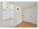 Hallway leading to a carpeted bedroom with natural light from windows at 3616 E Fairmount Ave, Phoenix, AZ 85018