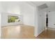 Bright living room filled with light, hardwood floors and bare white walls at 3616 E Fairmount Ave, Phoenix, AZ 85018