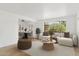 Open-concept living area seamlessly connects to a dining area with hardwood floors at 3616 E Fairmount Ave, Phoenix, AZ 85018