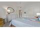Cozy bedroom with a grey quilt, neutral-toned furniture, and ample natural light at 3830 E Lakewood E Pkwy # 1007, Phoenix, AZ 85048