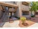 Exterior view of the building with multiple floors, landscaping and stairwell at 3830 E Lakewood E Pkwy # 1007, Phoenix, AZ 85048