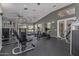Community gym with weight machines, treadmills and ample natural light for a complete workout experience at 3830 E Lakewood E Pkwy # 1007, Phoenix, AZ 85048