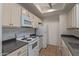 Functional kitchen featuring white appliances, ample counter space, and neutral cabinetry at 3830 E Lakewood E Pkwy # 1007, Phoenix, AZ 85048