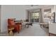 Open living room with patio access, neutral furniture and ample natural light at 3830 E Lakewood E Pkwy # 1007, Phoenix, AZ 85048