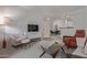 Inviting living room with neutral colors and cozy seating at 3830 E Lakewood E Pkwy # 1007, Phoenix, AZ 85048