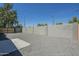 The backyard offers an empty gravel area with a small concrete patio and block wall fence, ready for customization at 47 Spur Cir, Scottsdale, AZ 85251