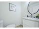 Powder room featuring stylish vanity with black faucet and accents at 47 Spur Cir, Scottsdale, AZ 85251