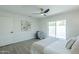Bright bedroom with a ceiling fan, neutral decor, and access to the outdoor living space at 47 Spur Cir, Scottsdale, AZ 85251