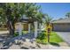 Home exterior featuring covered walkway, mailbox, landscaping, and paved driveway at 47 Spur Cir, Scottsdale, AZ 85251