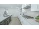 Modern kitchen with a gas range cooktop and a large island at 47 Spur Cir, Scottsdale, AZ 85251