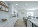 Kitchen featuring white cabinets, granite countertops, stainless steel appliances, and natural wood accents at 47 Spur Cir, Scottsdale, AZ 85251